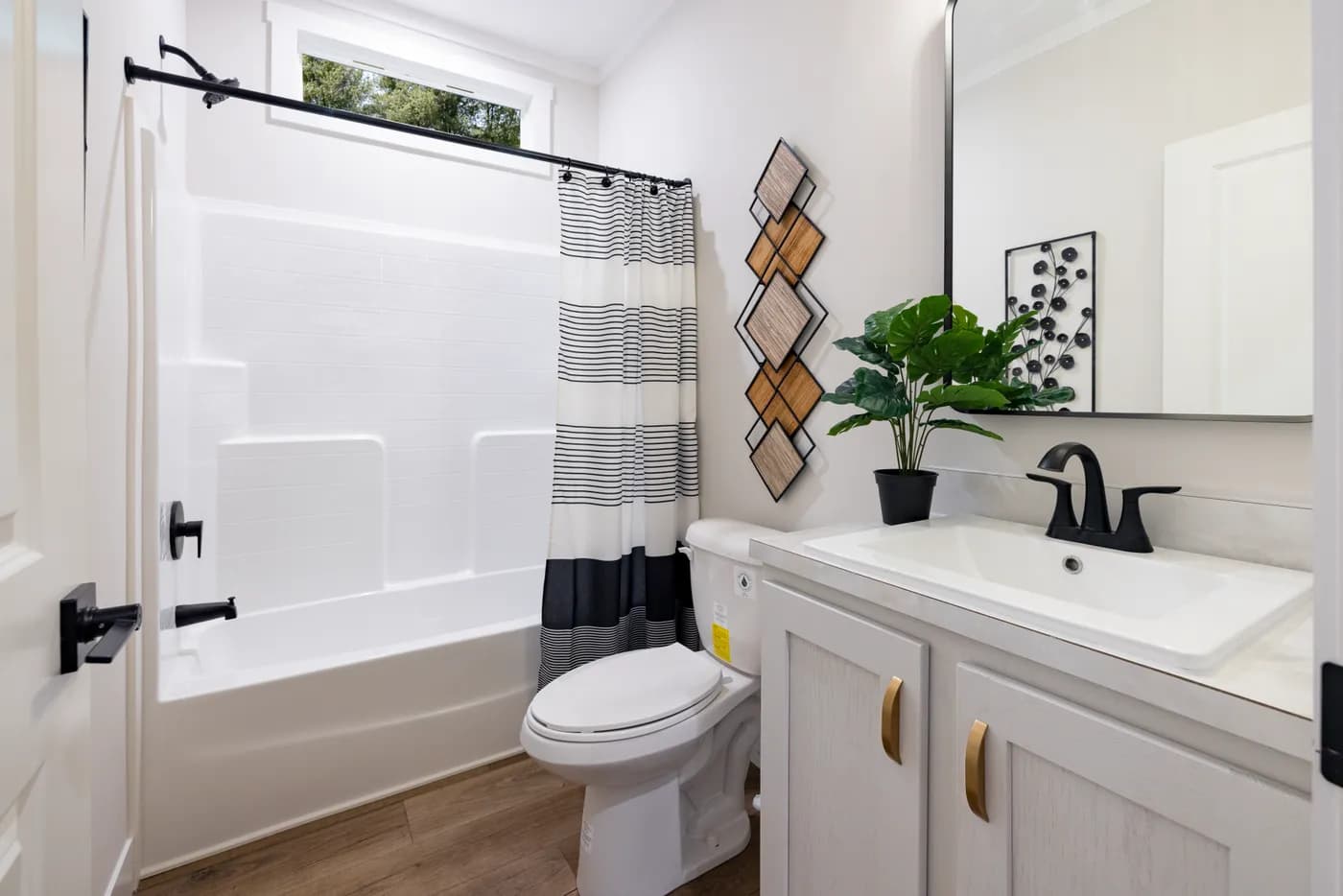 The SAVOR Guest Bathroom. This Manufactured Mobile Home features 3 bedrooms and 2 baths.