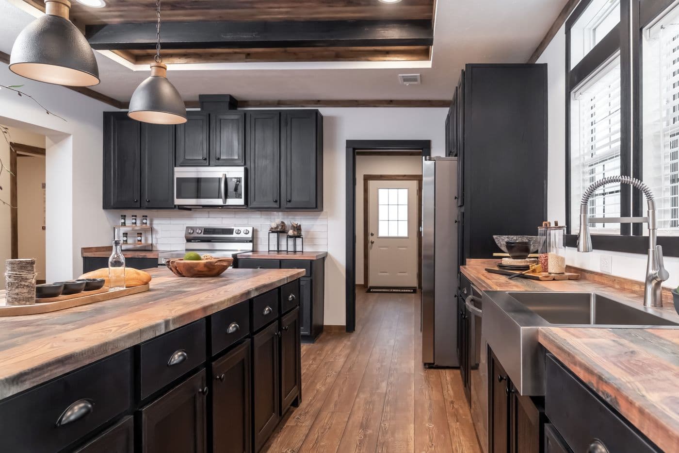 The THE MILL HOUSE Kitchen. This Manufactured Mobile Home features 3 bedrooms and 2 baths.