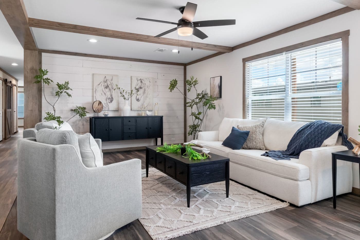 The FARM 4 FLEX Living Room. This Manufactured Mobile Home features 4 bedrooms and 3 baths.