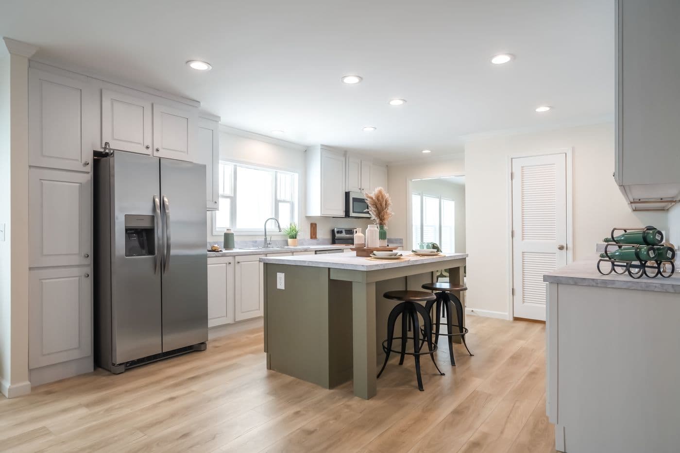 The 5430 "UWHARRIE" 7632 Kitchen. This Manufactured Mobile Home features 4 bedrooms and 2 baths.