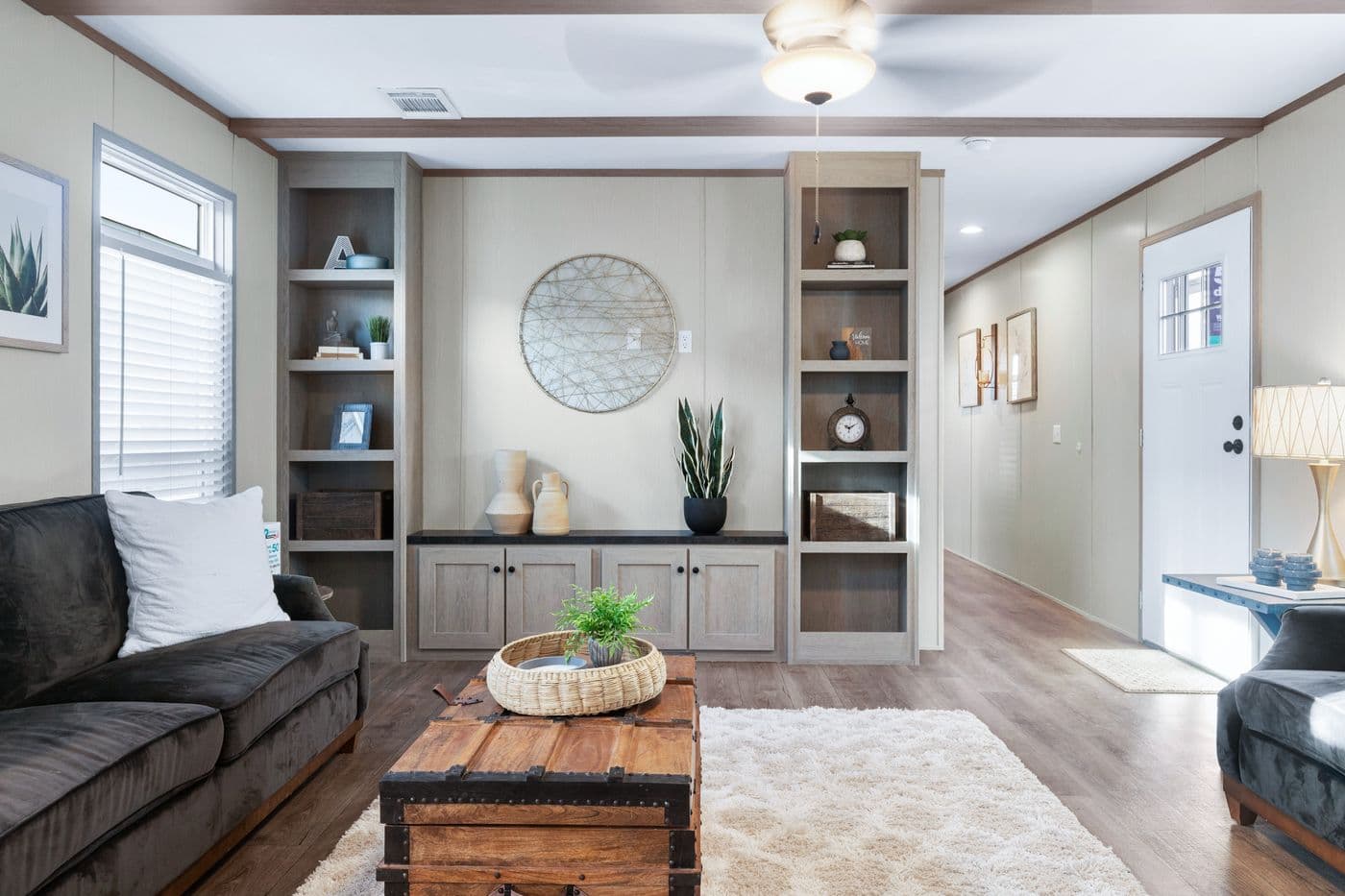 The ANNIVERSARY 16763A Living Room. This Manufactured Mobile Home features 3 bedrooms and 2 baths.