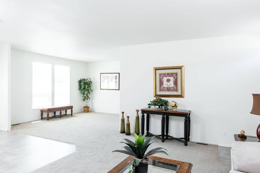 The 2025 COLUMBIA RIVER (NEW) Living Room. This Manufactured Mobile Home features 4 bedrooms and 2 baths.