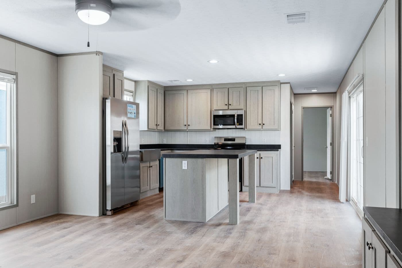 The RESOLUTION 16763H Kitchen. This Manufactured Mobile Home features 3 bedrooms and 2 baths.