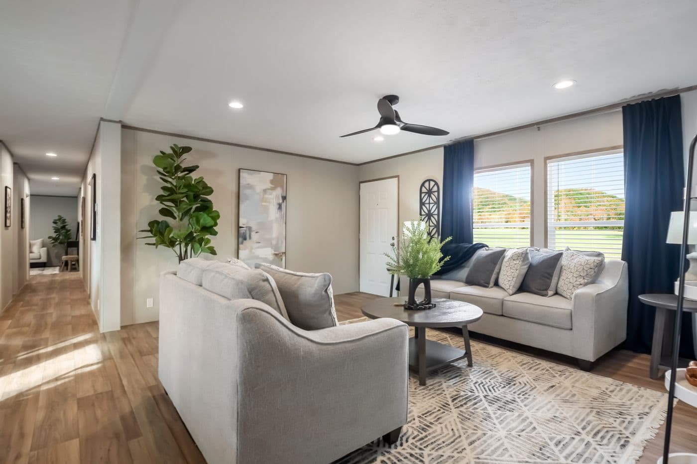 The ECLIPSE Living Room. This Manufactured Mobile Home features 4 bedrooms and 2 baths.
