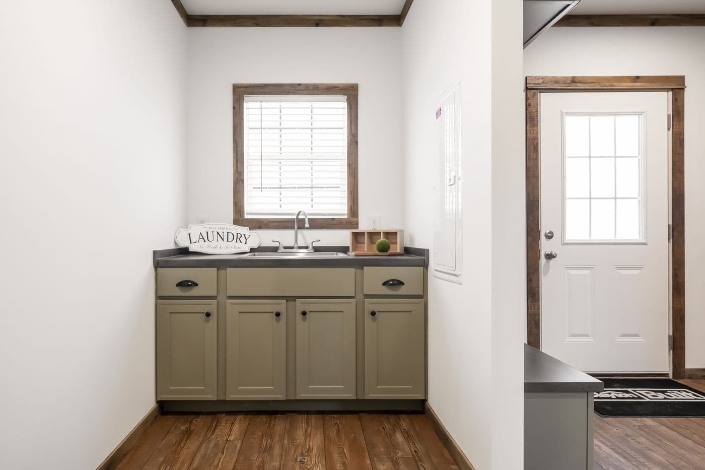 The THE MILL HOUSE Foyer. This Manufactured Mobile Home features 3 bedrooms and 2 baths.