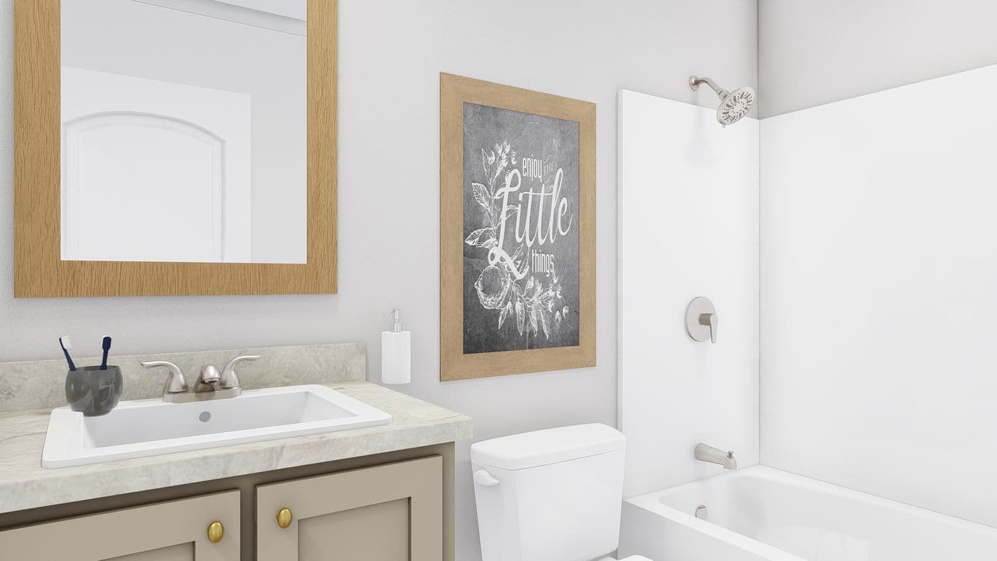 The STAYIN' ALIVE Guest Bathroom. This Manufactured Mobile Home features 3 bedrooms and 2 baths.