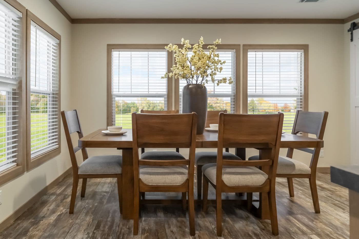 The BOUJEE PREMIER Dining Room. This Manufactured Mobile Home features 4 bedrooms and 2 baths.