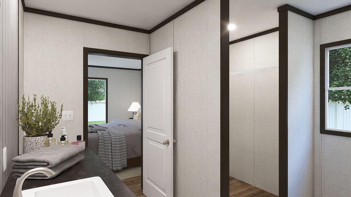 The AMBITION Primary Bathroom. This Manufactured Mobile Home features 4 bedrooms and 2 baths.