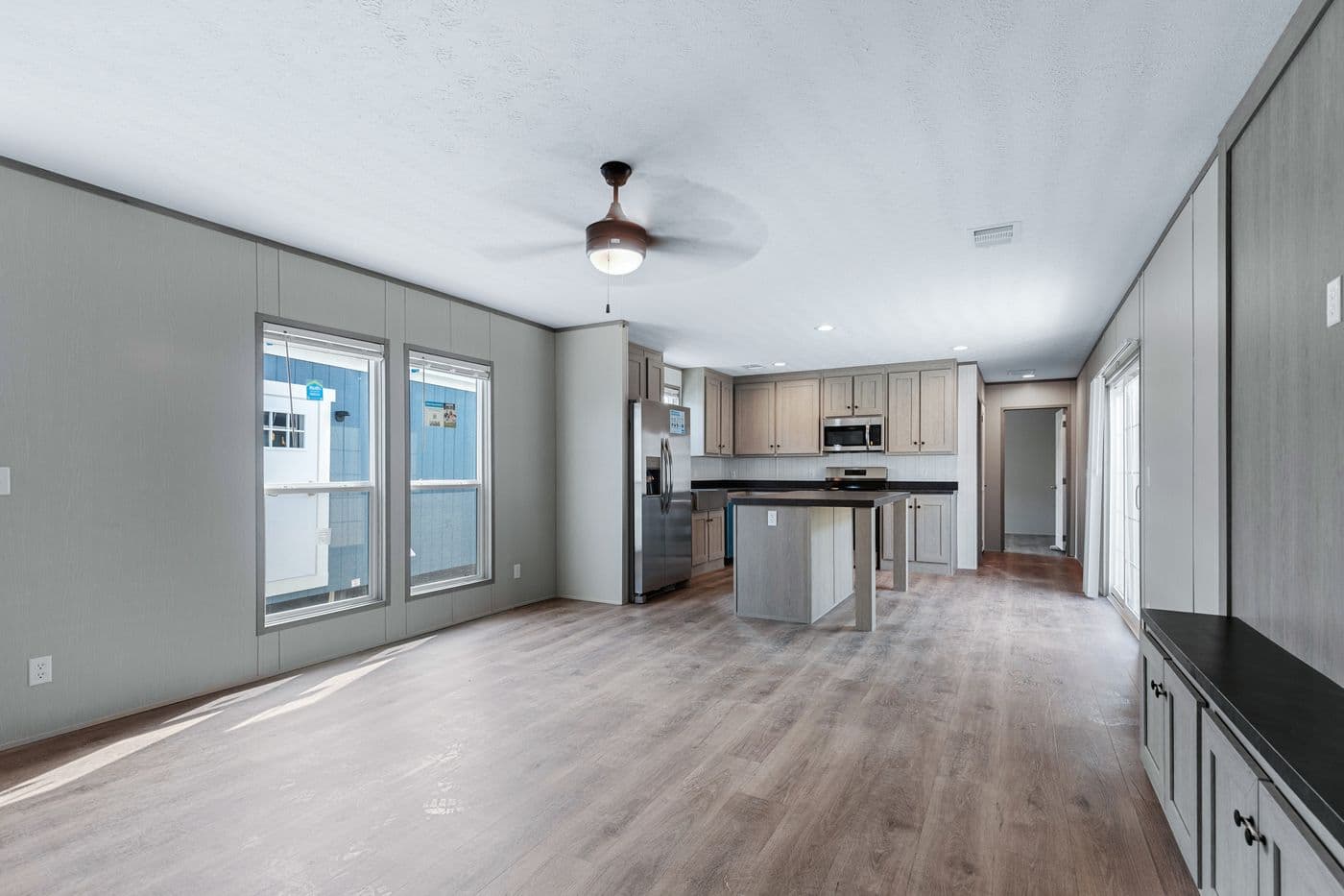 The RESOLUTION 16763H Living Room. This Manufactured Mobile Home features 3 bedrooms and 2 baths.