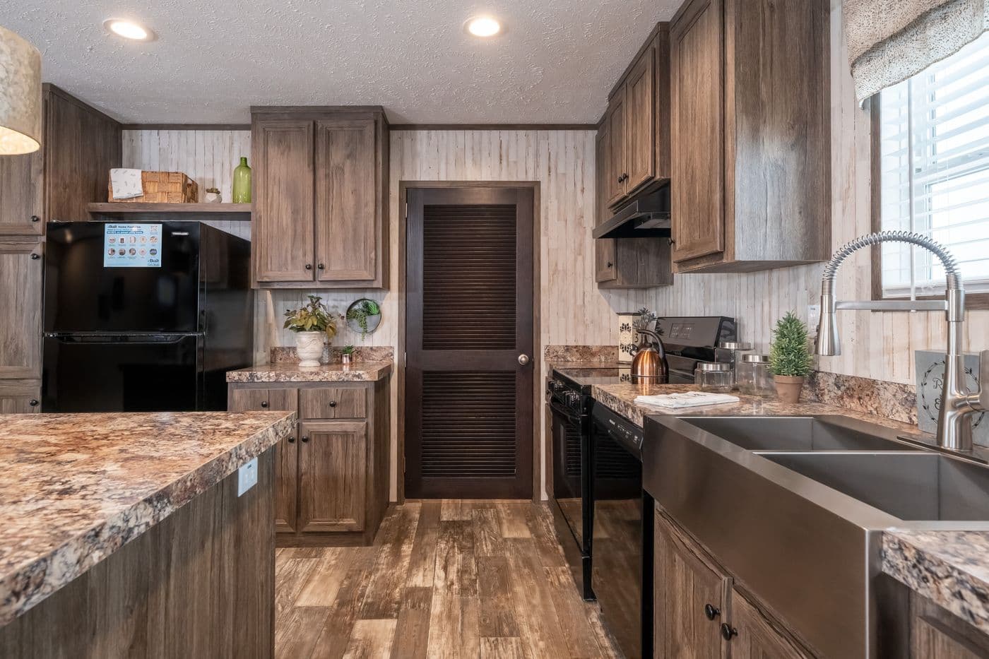 The HARDIN Kitchen. This Manufactured Mobile Home features 3 bedrooms and 2 baths.