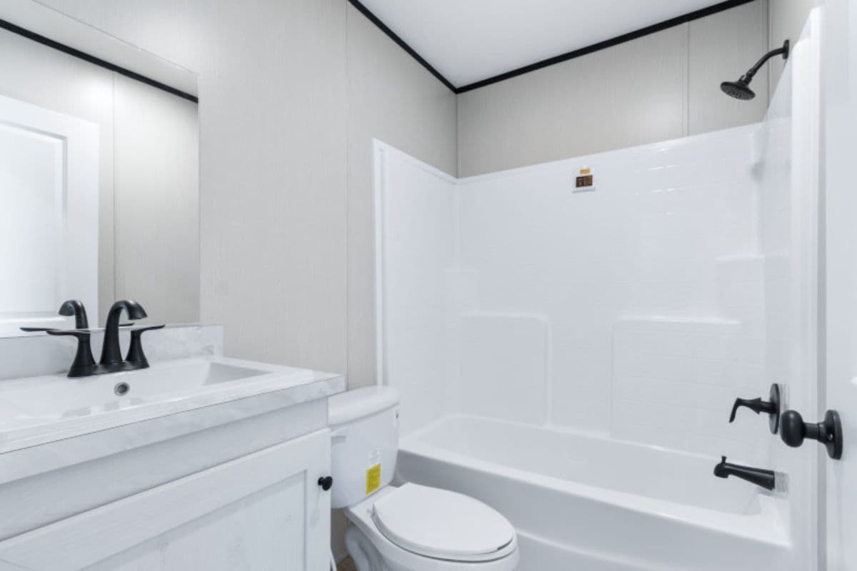The ANNIVERSARY 16763S Kitchen. This Manufactured Mobile Home features 3 bedrooms and 2 baths.