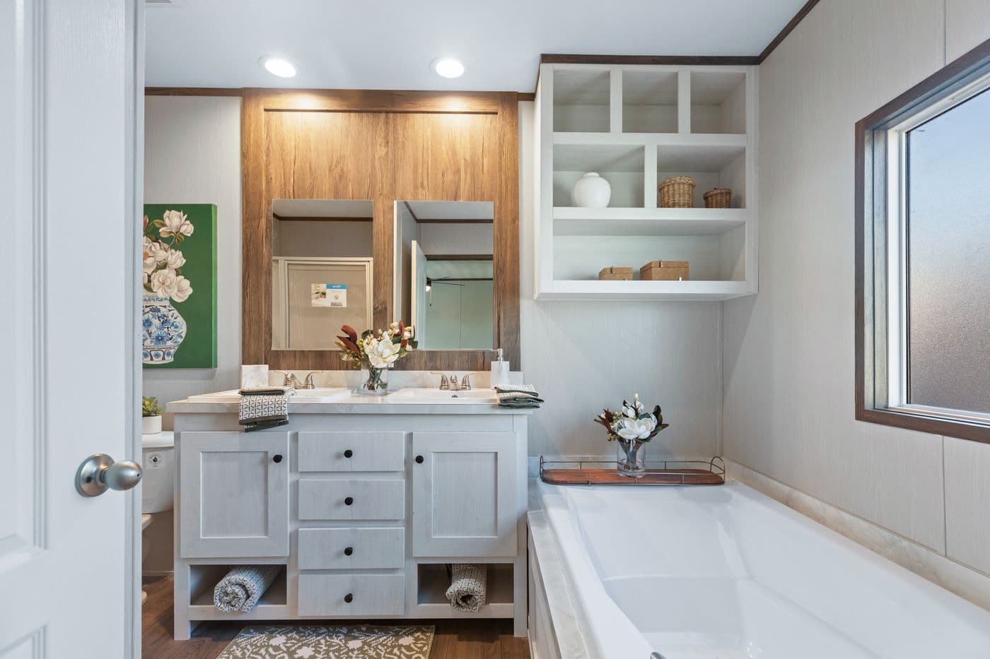The RETREAT LIVING 16682A Primary Bathroom. This Manufactured Mobile Home features 2 bedrooms and 2 baths.