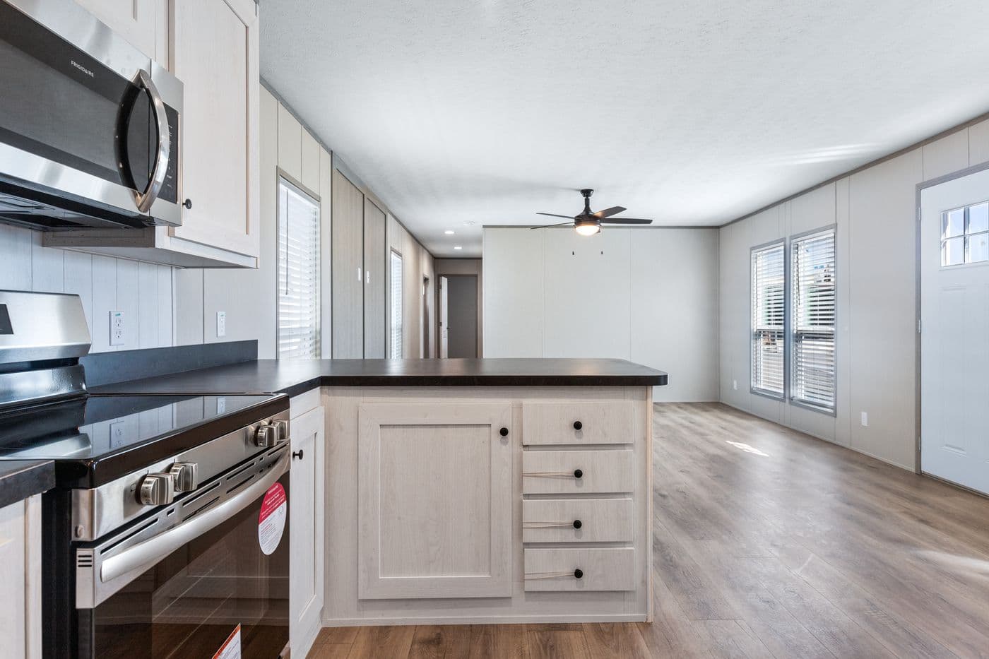 The RESOLUTION 16763K Kitchen. This Manufactured Mobile Home features 3 bedrooms and 2 baths.