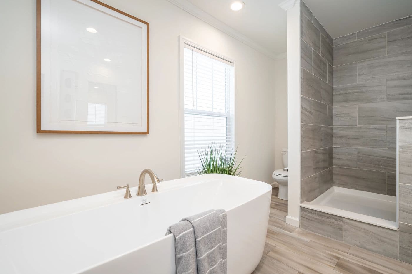 The 5410 "RIVER" 5628 Primary Bathroom. This Manufactured Mobile Home features 3 bedrooms and 2 baths.