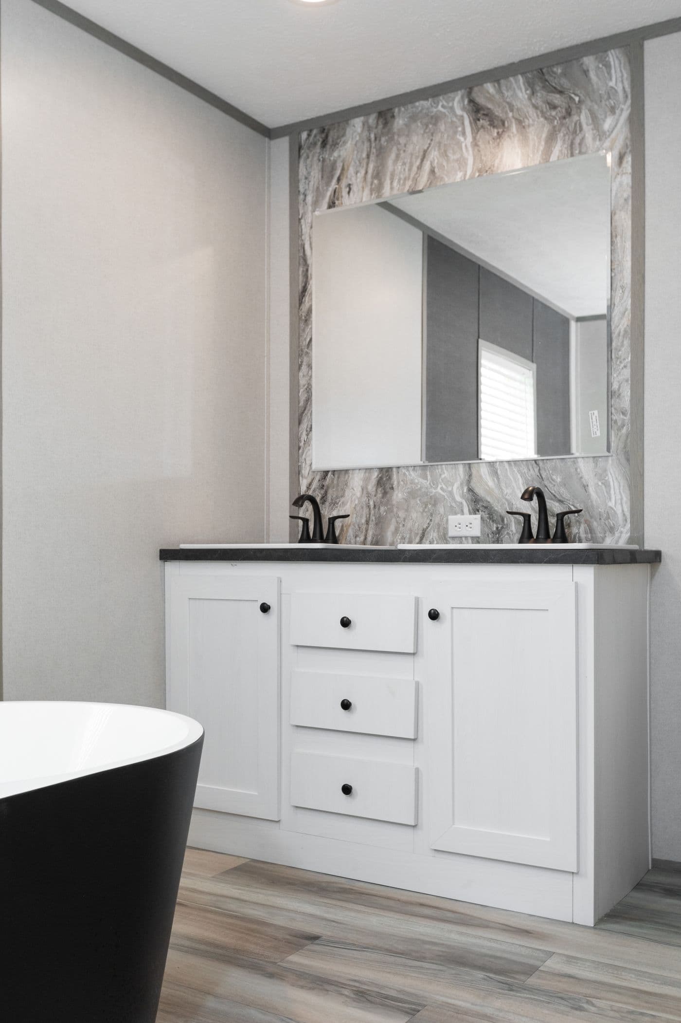 The PLATINUM ANNIVERSARY Primary Bathroom. This Manufactured Mobile Home features 3 bedrooms and 2 baths.