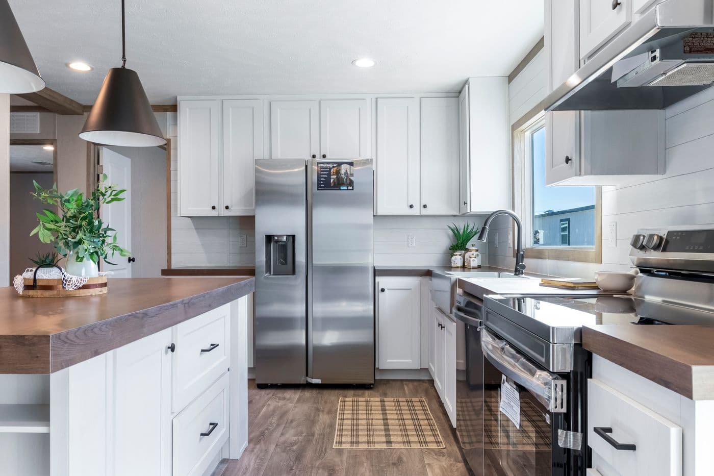 The THE BIG DEAL 52 Kitchen. This Manufactured Mobile Home features 3 bedrooms and 2 baths.