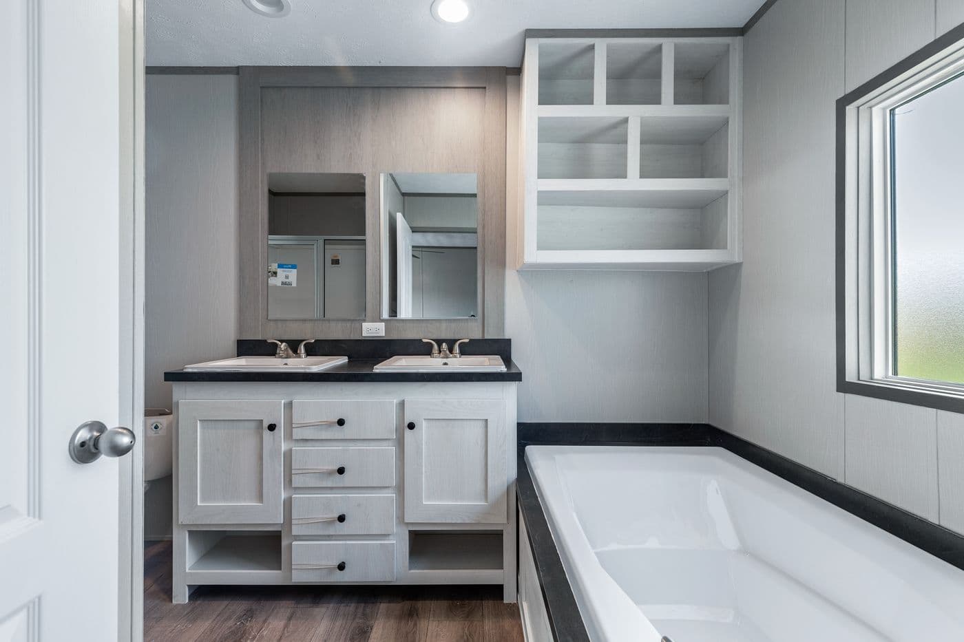 The RESOLUTION 16763H Primary Bathroom. This Manufactured Mobile Home features 3 bedrooms and 2 baths.