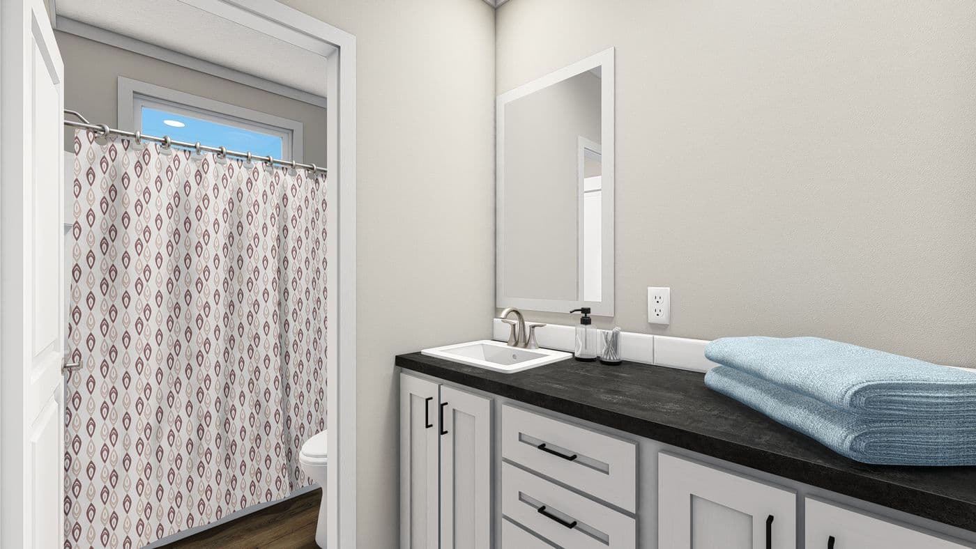 The THE DENALI Guest Bathroom. This Manufactured Mobile Home features 3 bedrooms and 2 baths.
