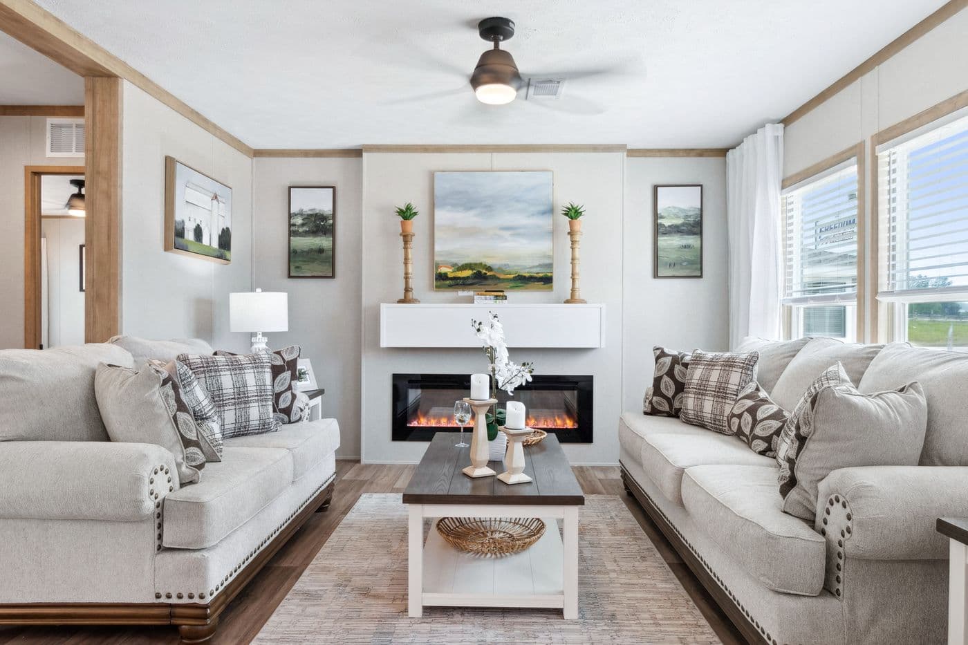 The BREEZE FARMHOUSE 72 Living Room. This Manufactured Mobile Home features 4 bedrooms and 2 baths.
