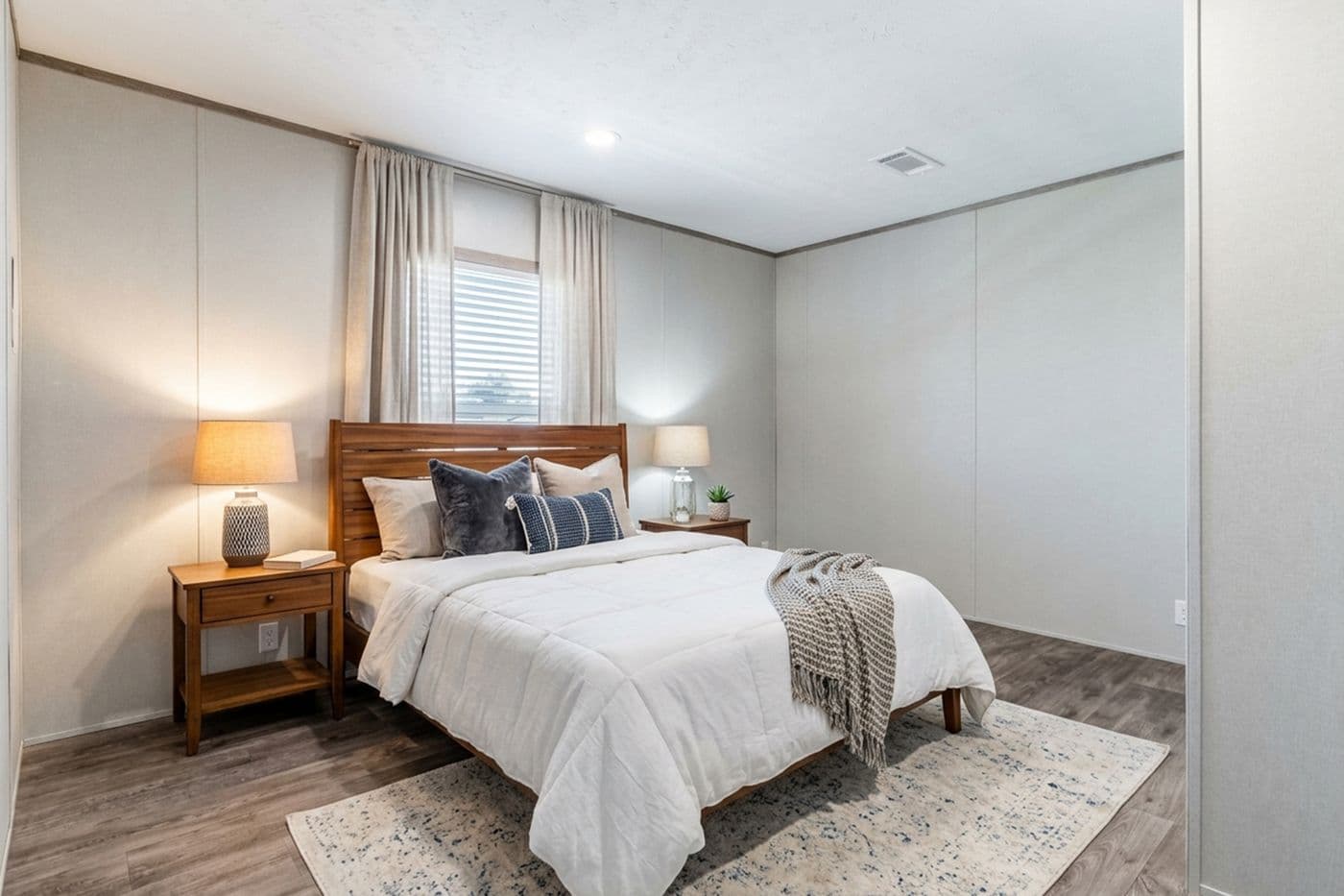 The THE BIG DEAL 52 Guest Bedroom. This Manufactured Mobile Home features 3 bedrooms and 2 baths.