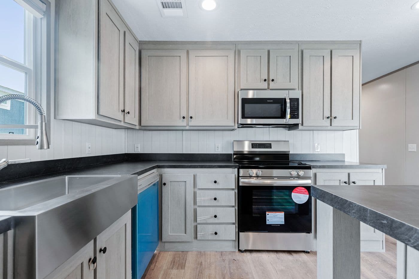 The RESOLUTION 16763H Kitchen. This Manufactured Mobile Home features 3 bedrooms and 2 baths.