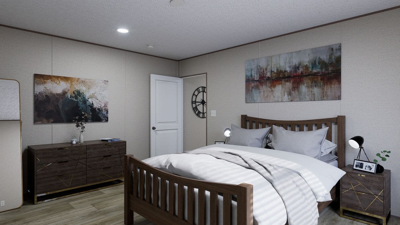 The FOOTHILLS 76 Primary Bedroom. This Manufactured Mobile Home features 3 bedrooms and 2 baths.