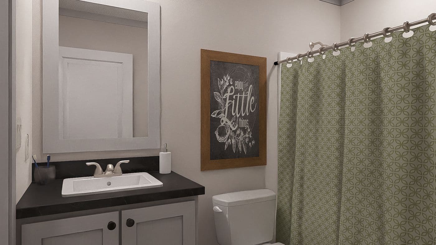 The STAYIN' ALIVE Guest Bathroom. This Manufactured Mobile Home features 3 bedrooms and 2 baths.
