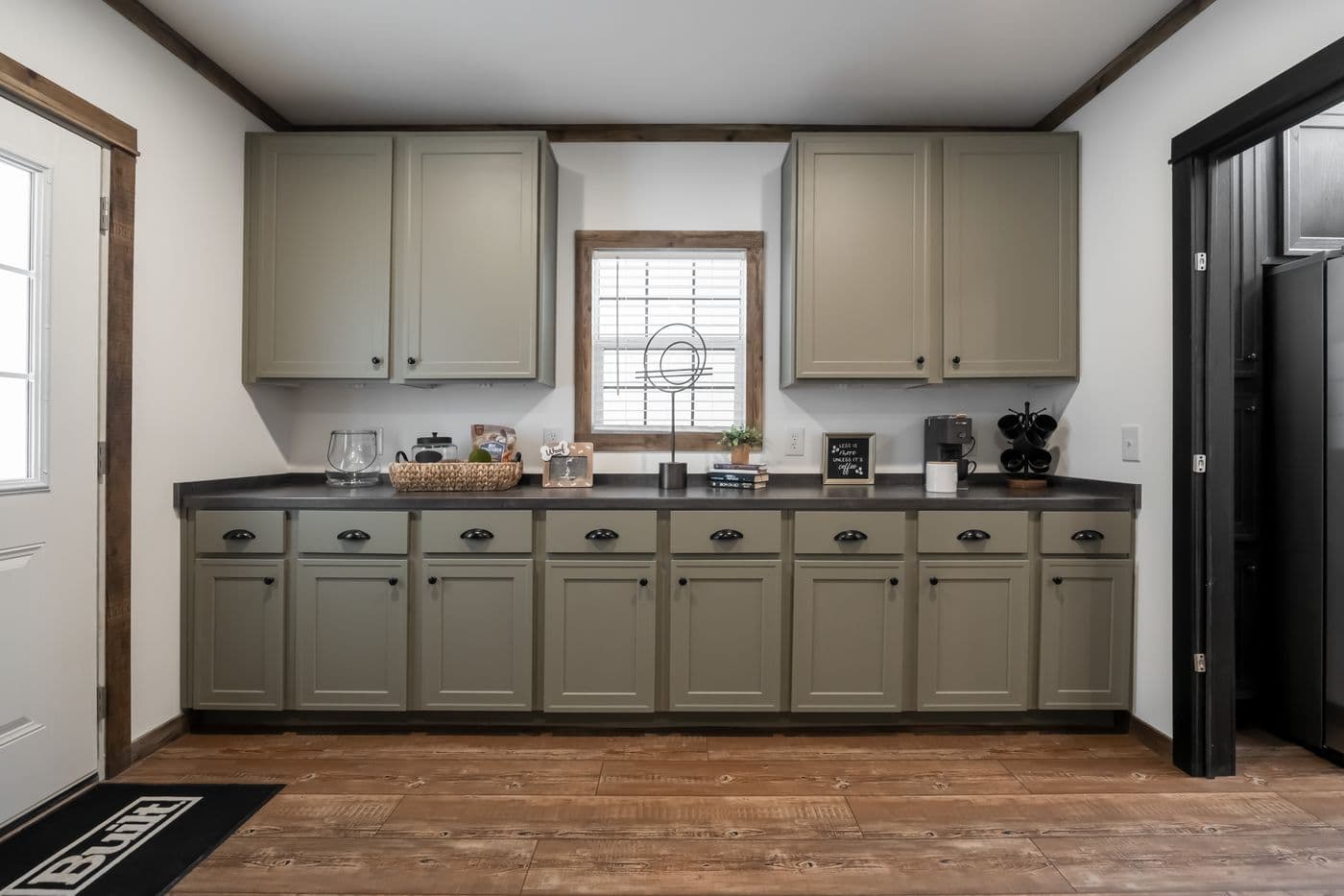 The THE MILL HOUSE Kitchen. This Manufactured Mobile Home features 3 bedrooms and 2 baths.