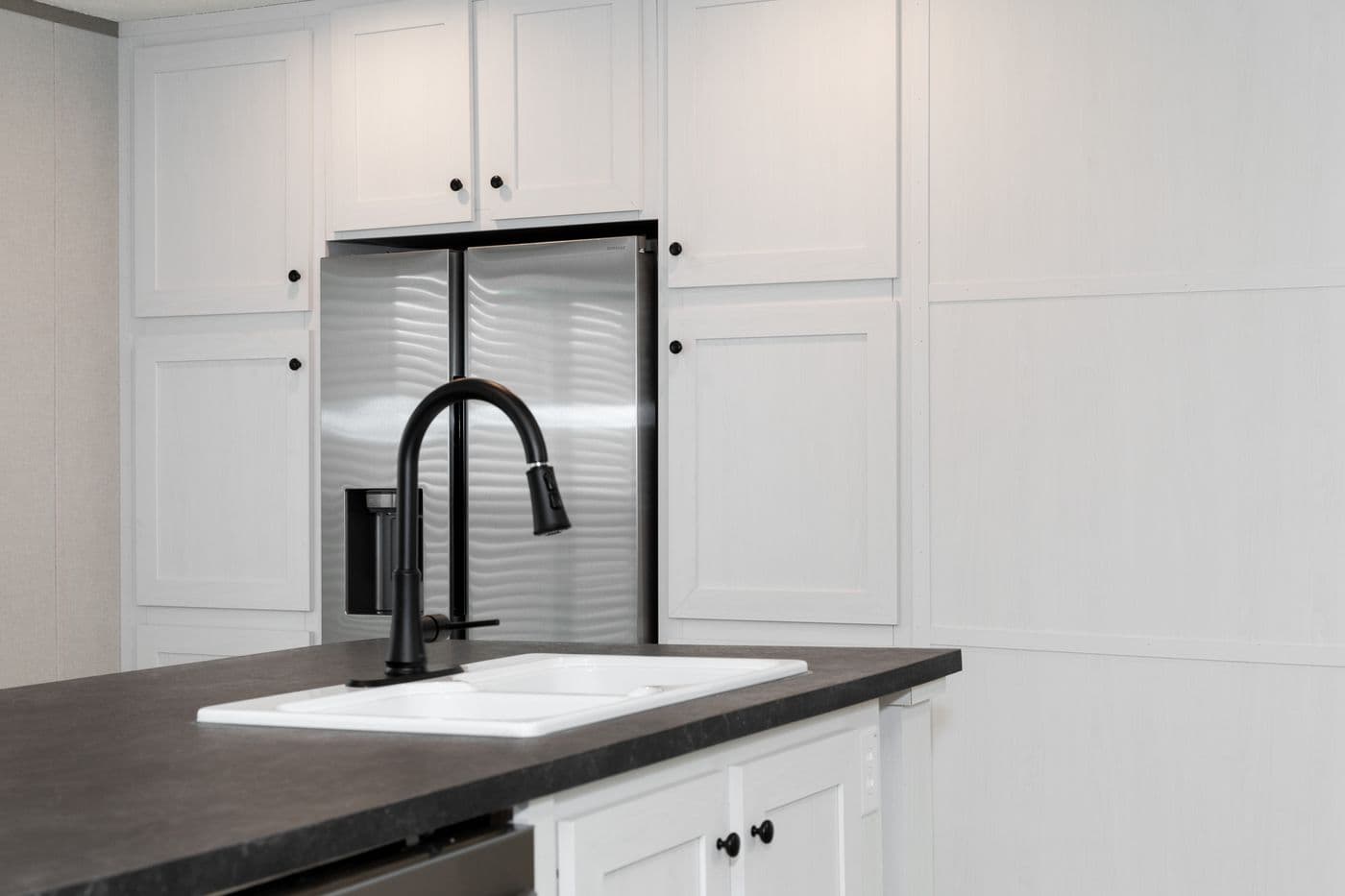 The PLATINUM ANNIVERSARY Kitchen. This Manufactured Mobile Home features 3 bedrooms and 2 baths.