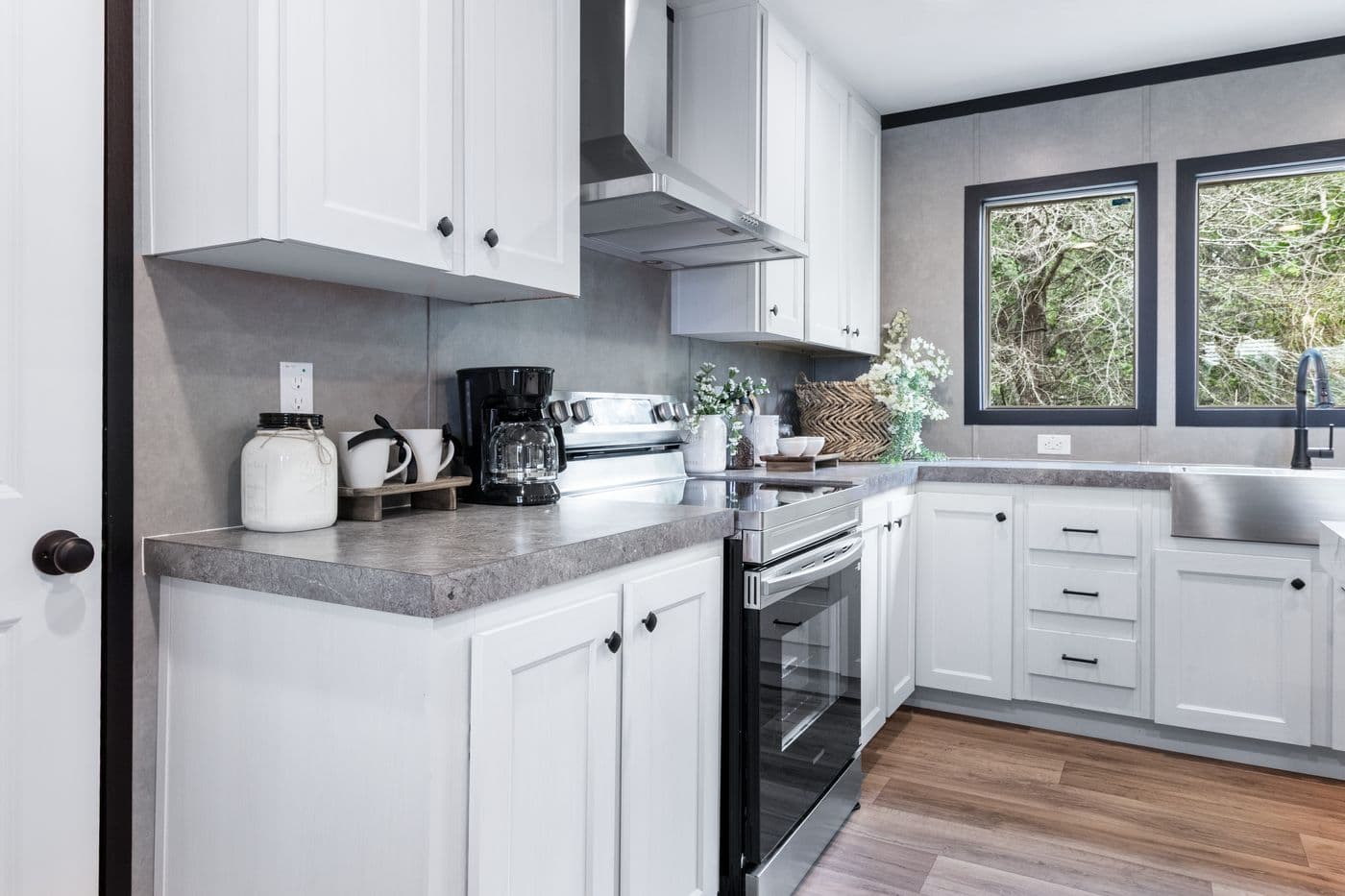 The ABSOLUTE VALUE Kitchen. This Manufactured Mobile Home features 4 bedrooms and 2 baths.