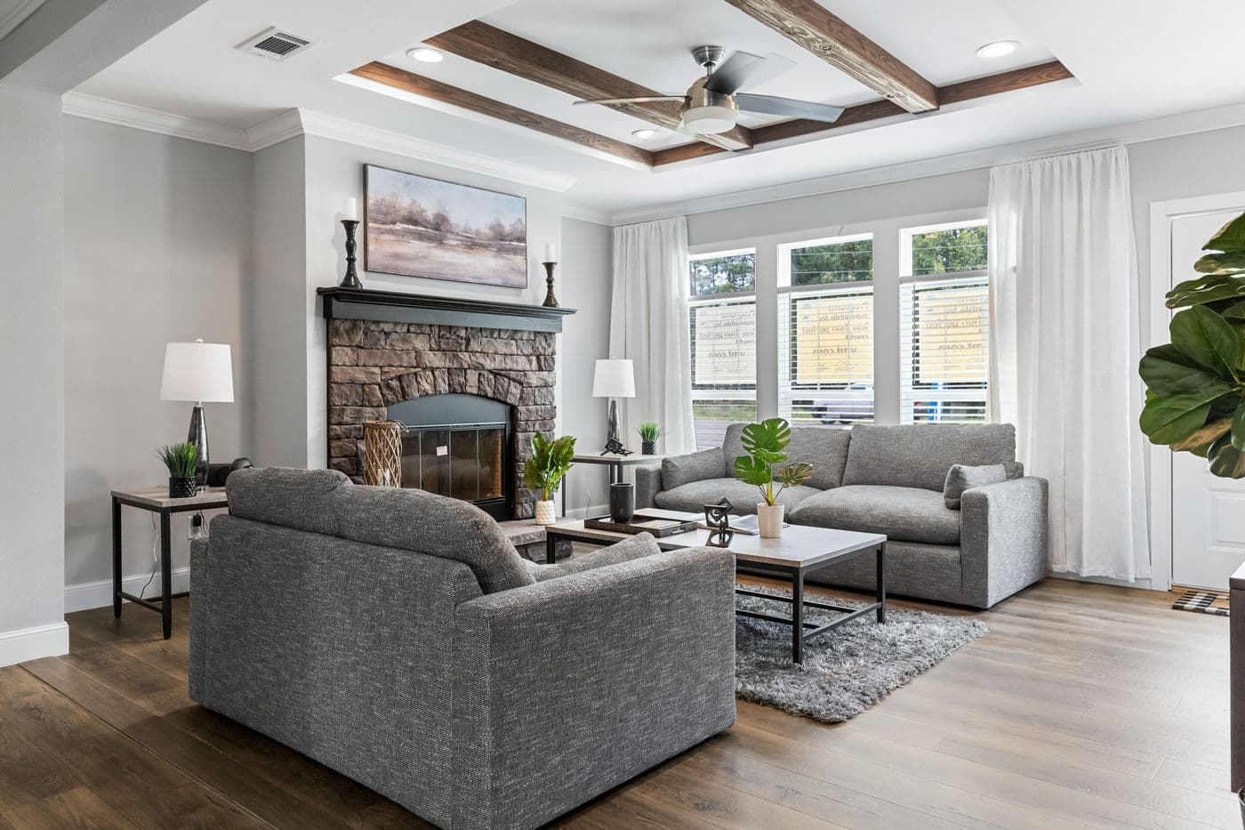 The THE MONTERREY Living Room. This Manufactured Mobile Home features 4 bedrooms and 3 baths.