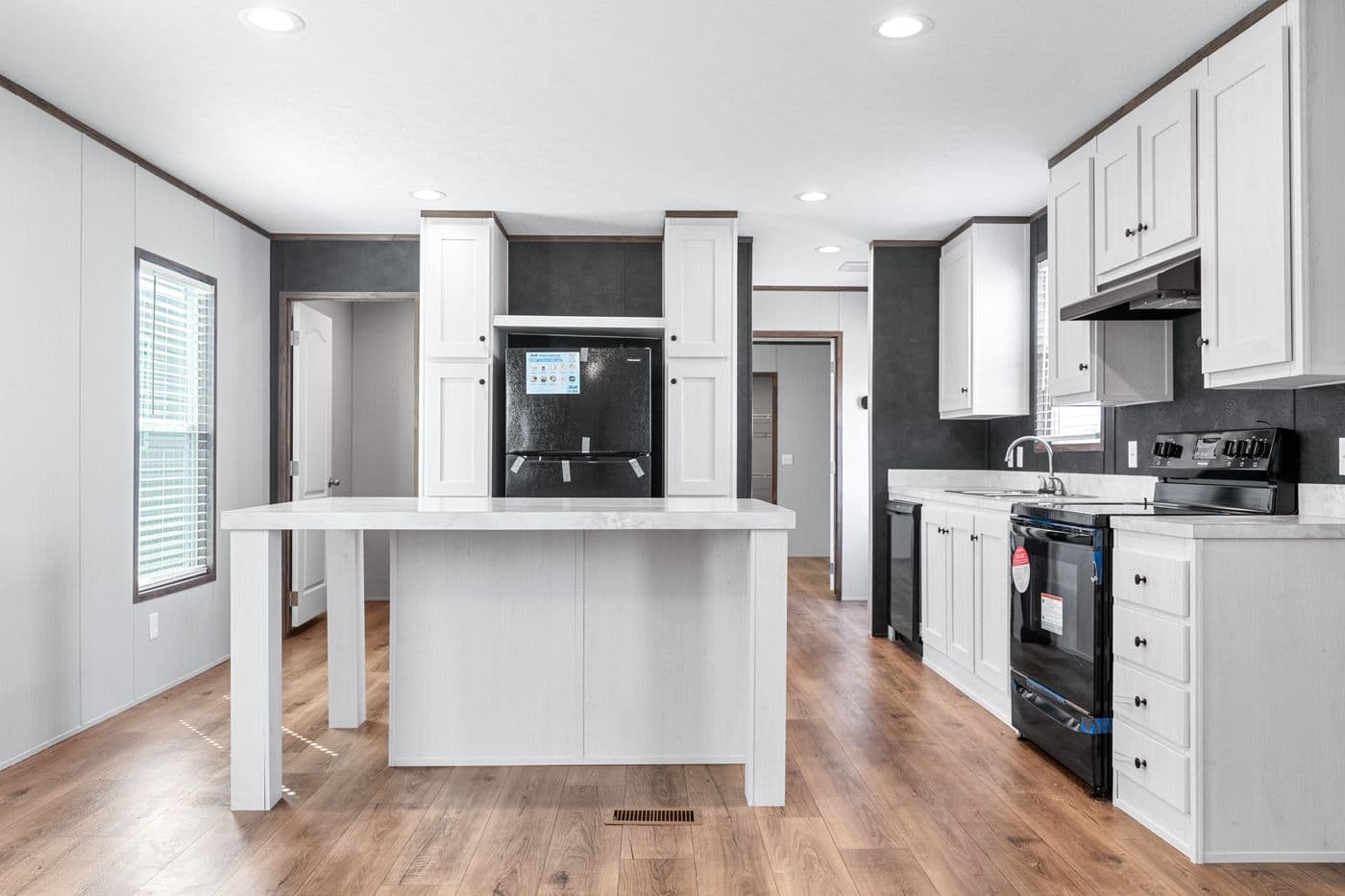The HOMESTEAD 16602A Kitchen. This Manufactured Mobile Home features 2 bedrooms and 2 baths.