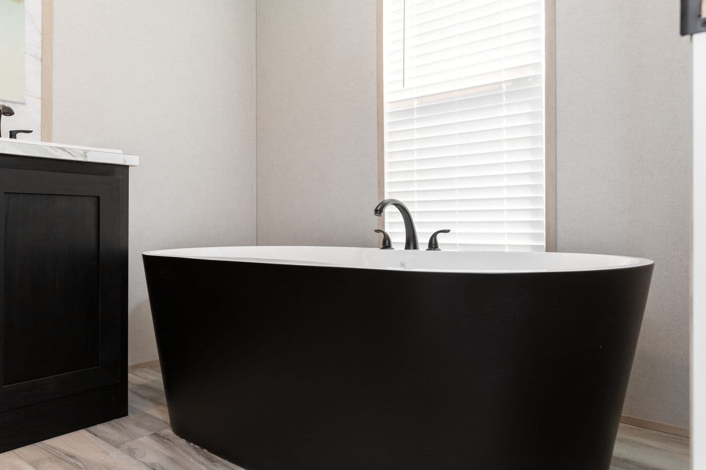 The THE ANNIVERSARY ISLANDER Primary Bathroom. This Manufactured Mobile Home features 3 bedrooms and 2 baths.