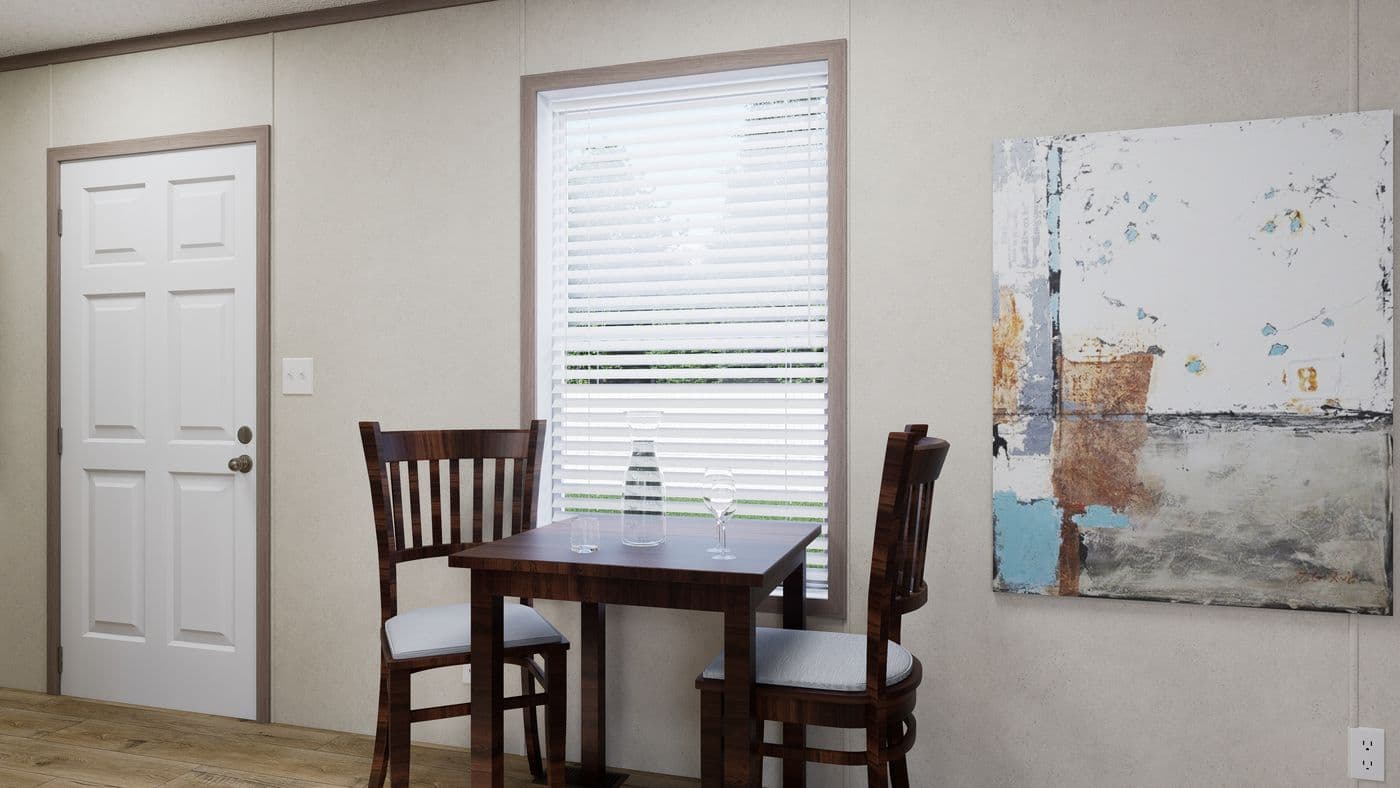 The 4816-CC05 OASIS 48 Dining Area. This Manufactured Mobile Home features 2 bedrooms and 1 bath.