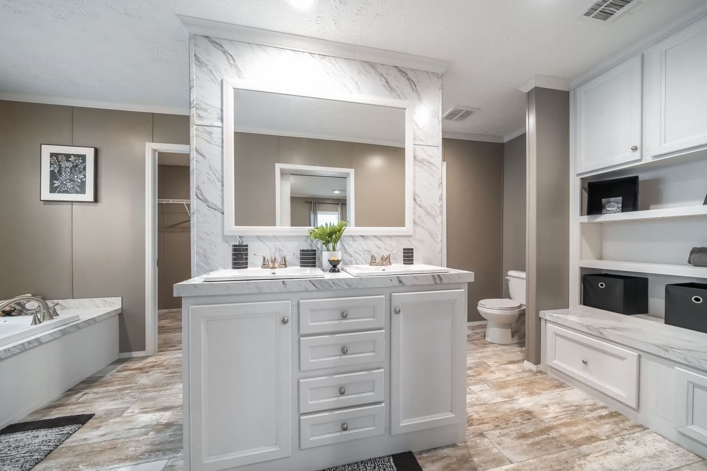 The CASCADE Primary Bathroom. This Manufactured Mobile Home features 4 bedrooms and 2 baths.