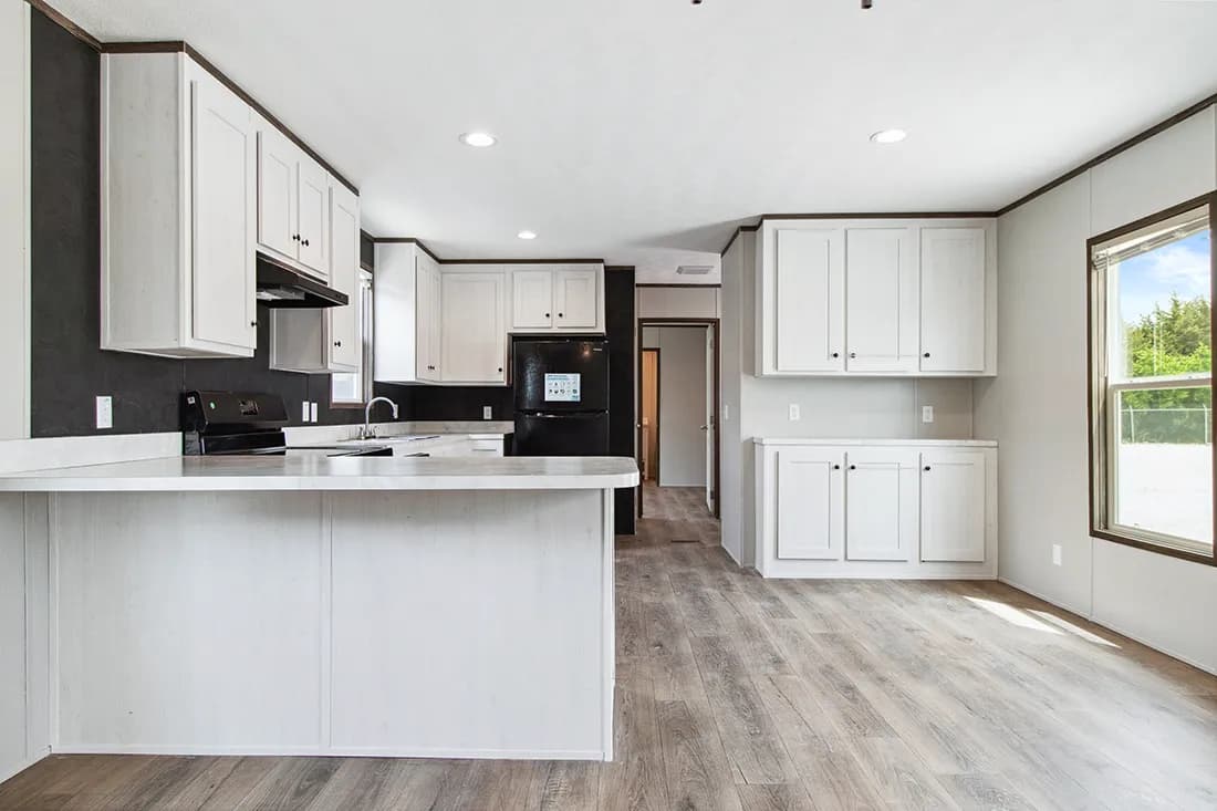 The HOMESTEAD 16562A Kitchen. This Manufactured Mobile Home features 2 bedrooms and 2 baths.