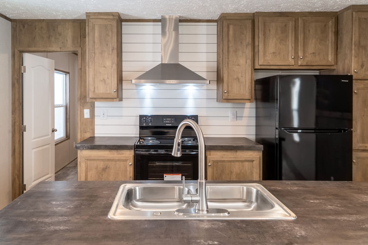 The THE BREEZE Exterior. This Manufactured Mobile Home features 3 bedrooms and 2 baths.