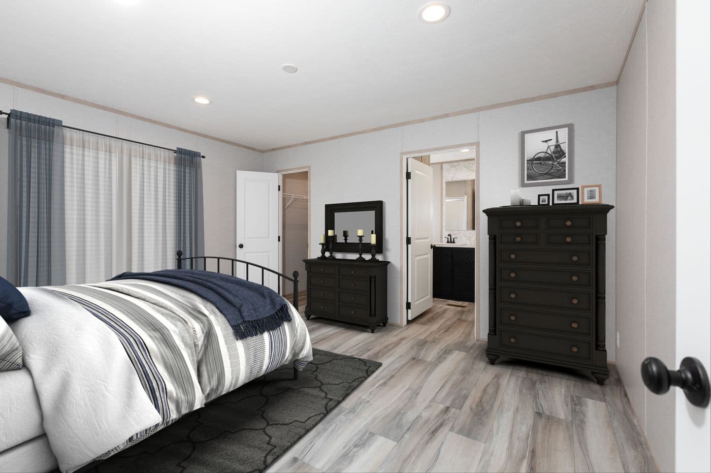 The THE ANNIVERSARY ISLANDER Primary Bedroom. This Manufactured Mobile Home features 3 bedrooms and 2 baths.