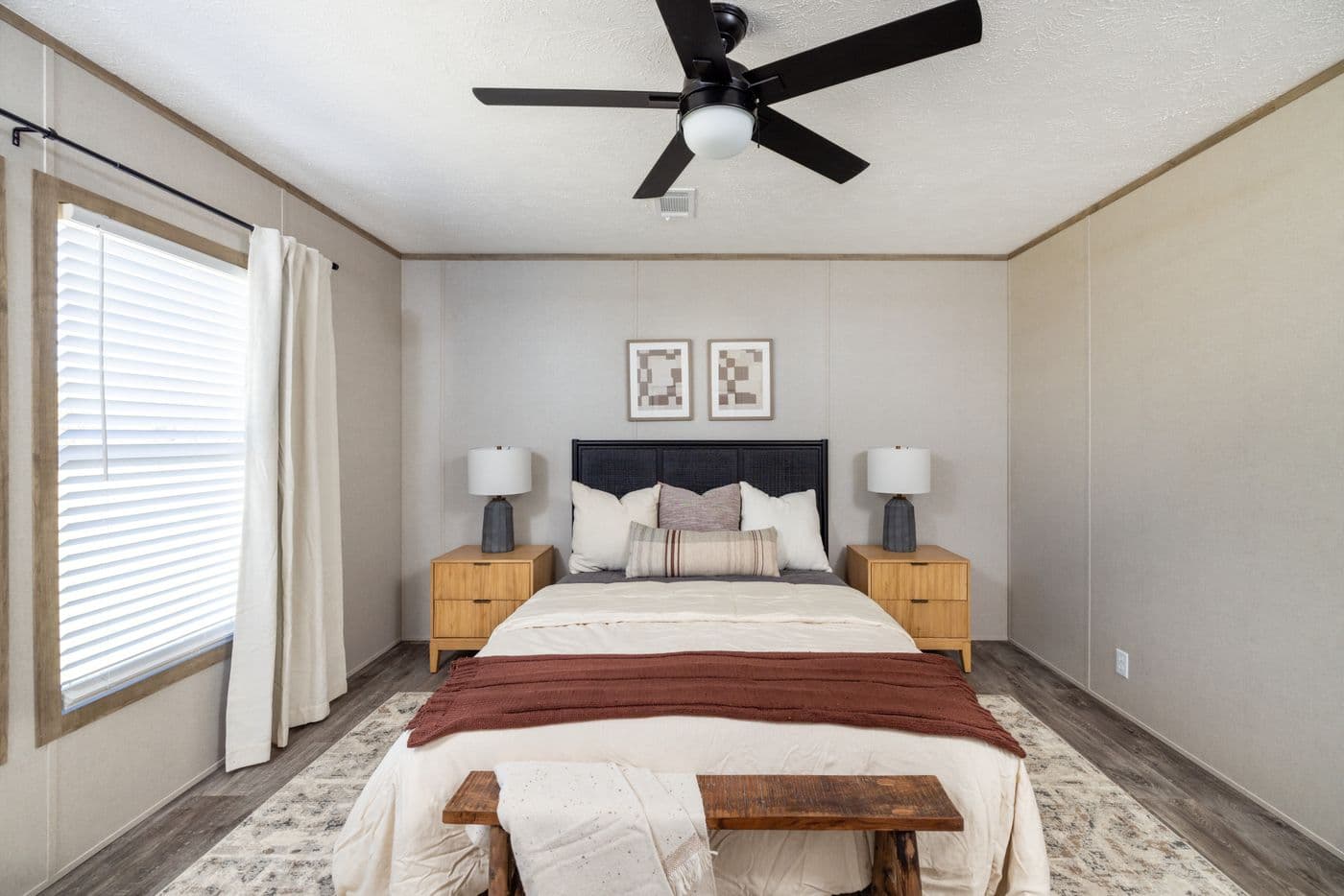 The STERLING ANNIVERSARY Primary Bedroom. This Manufactured Mobile Home features 3 bedrooms and 2 baths.