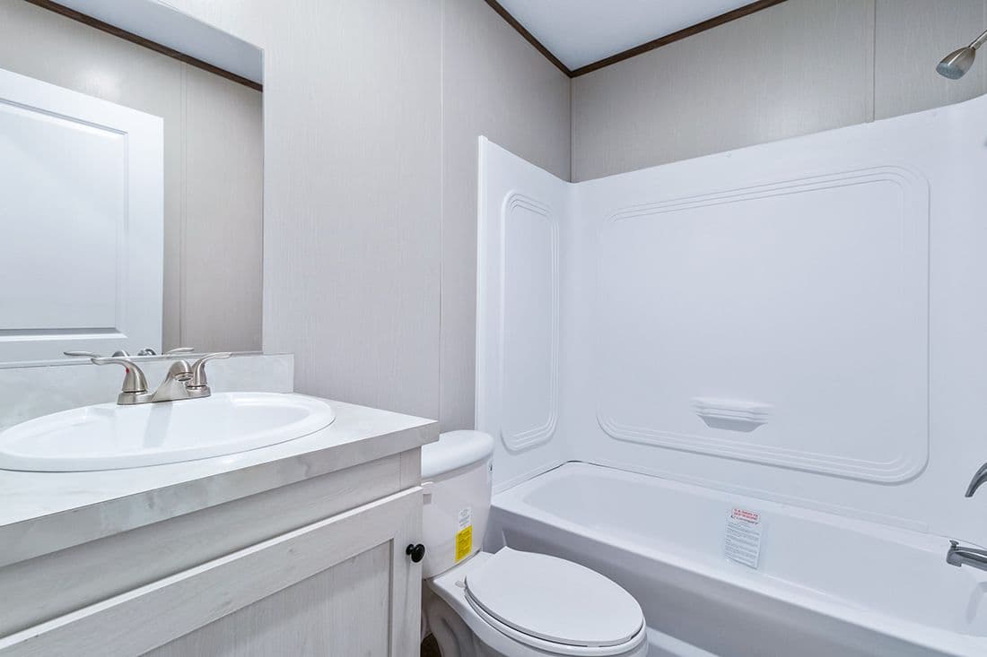 The SELECT 16723F Guest Bathroom. This Manufactured Mobile Home features 3 bedrooms and 2 baths.