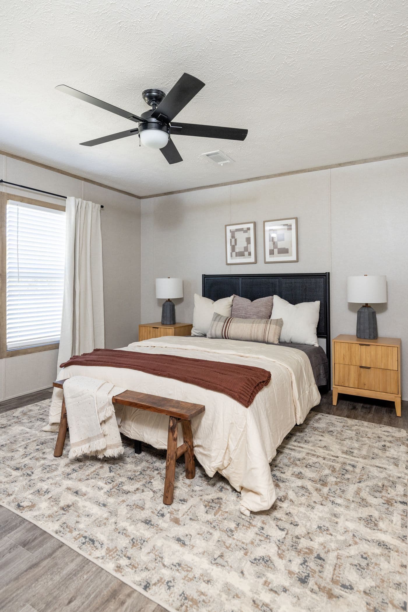 The STERLING ANNIVERSARY Primary Bedroom. This Manufactured Mobile Home features 3 bedrooms and 2 baths.