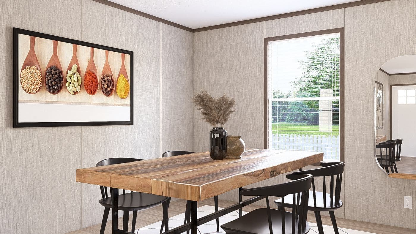 The THE RESERVE 60 Dining Area. This Manufactured Mobile Home features 3 bedrooms and 2 baths.