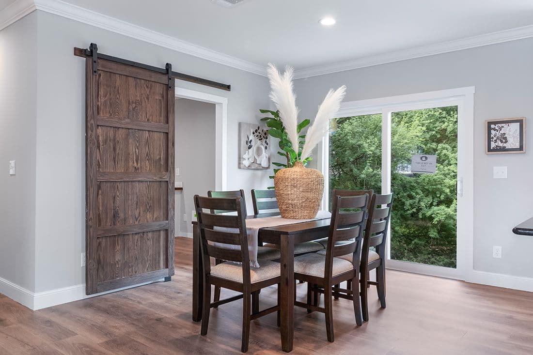 The THE OCEANSIDE Dining Room. This Manufactured Mobile Home features 4 bedrooms and 3 baths.