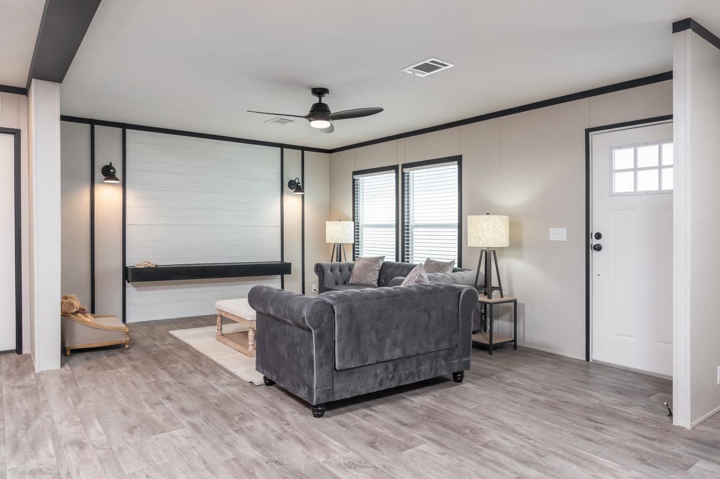 The BREEZE FARMHOUSE Living Room. This Manufactured Mobile Home features 3 bedrooms and 2 baths.