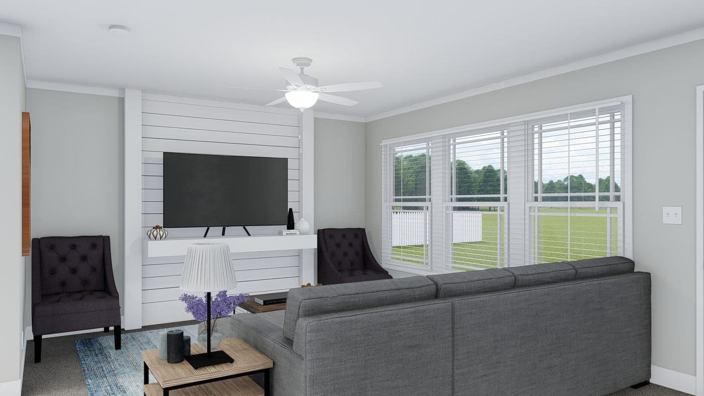 The THE BREEZE Living Room. This Manufactured Mobile Home features 3 bedrooms and 2 baths.