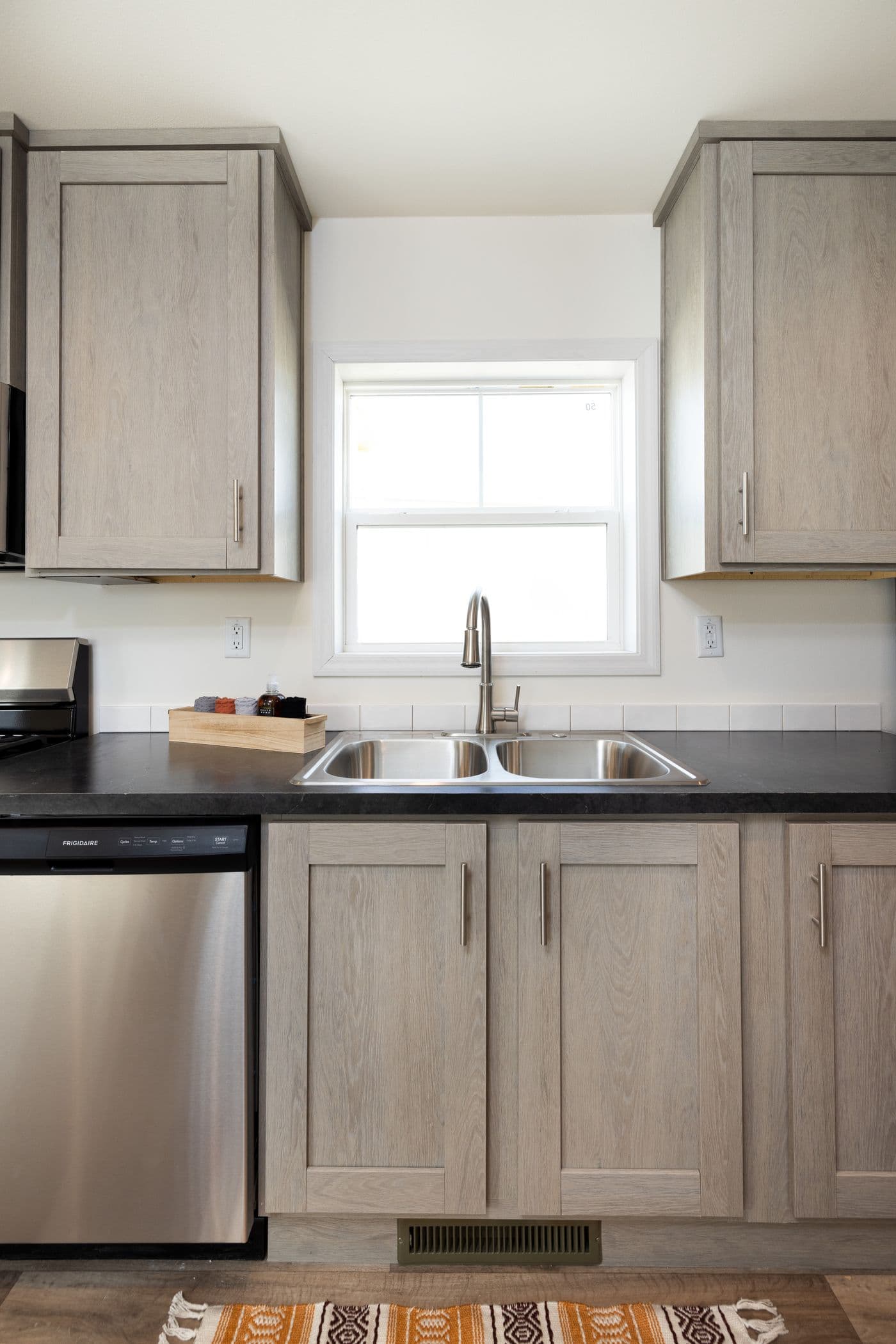 The RAMSEY 216-2 Kitchen. This Manufactured Mobile Home features 3 bedrooms and 2 baths.