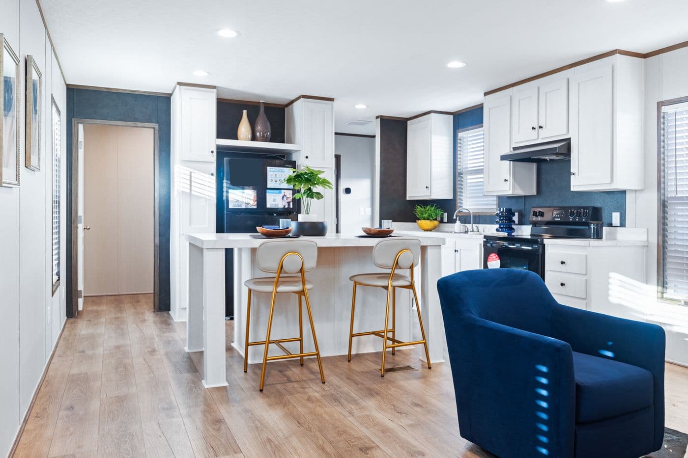 The HOMESTEAD 16763A Kitchen. This Manufactured Mobile Home features 3 bedrooms and 2 baths.