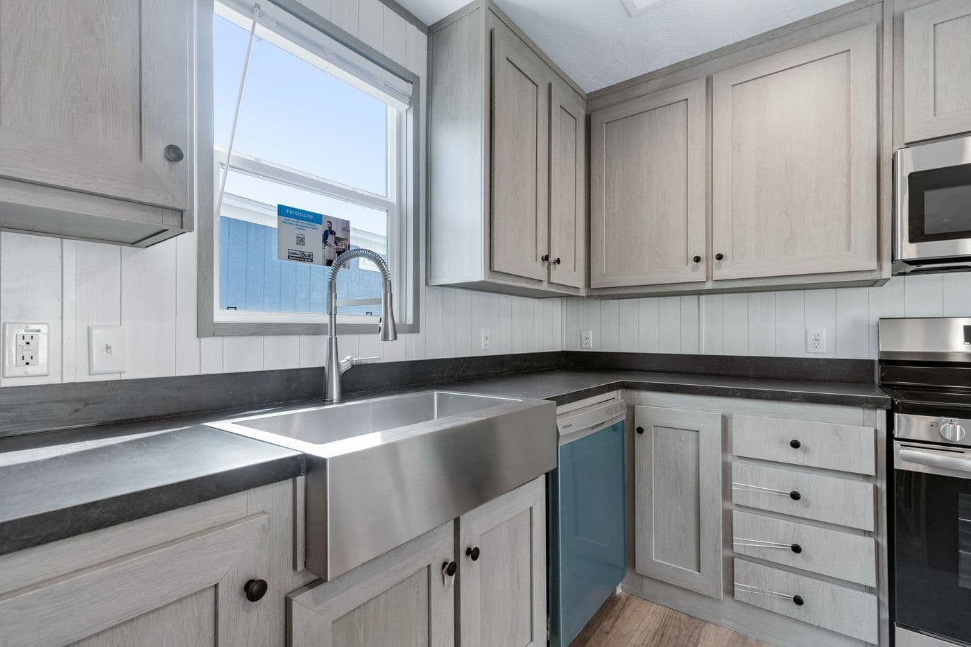 The RESOLUTION 16763H Kitchen. This Manufactured Mobile Home features 3 bedrooms and 2 baths.