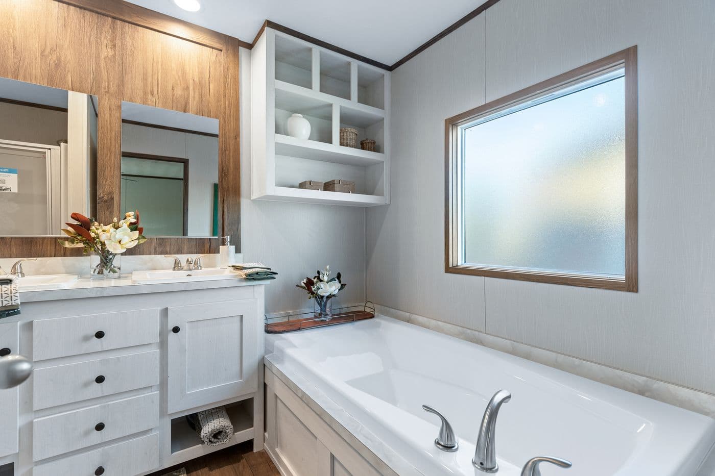 The RETREAT LIVING 16682A Primary Bathroom. This Manufactured Mobile Home features 2 bedrooms and 2 baths.