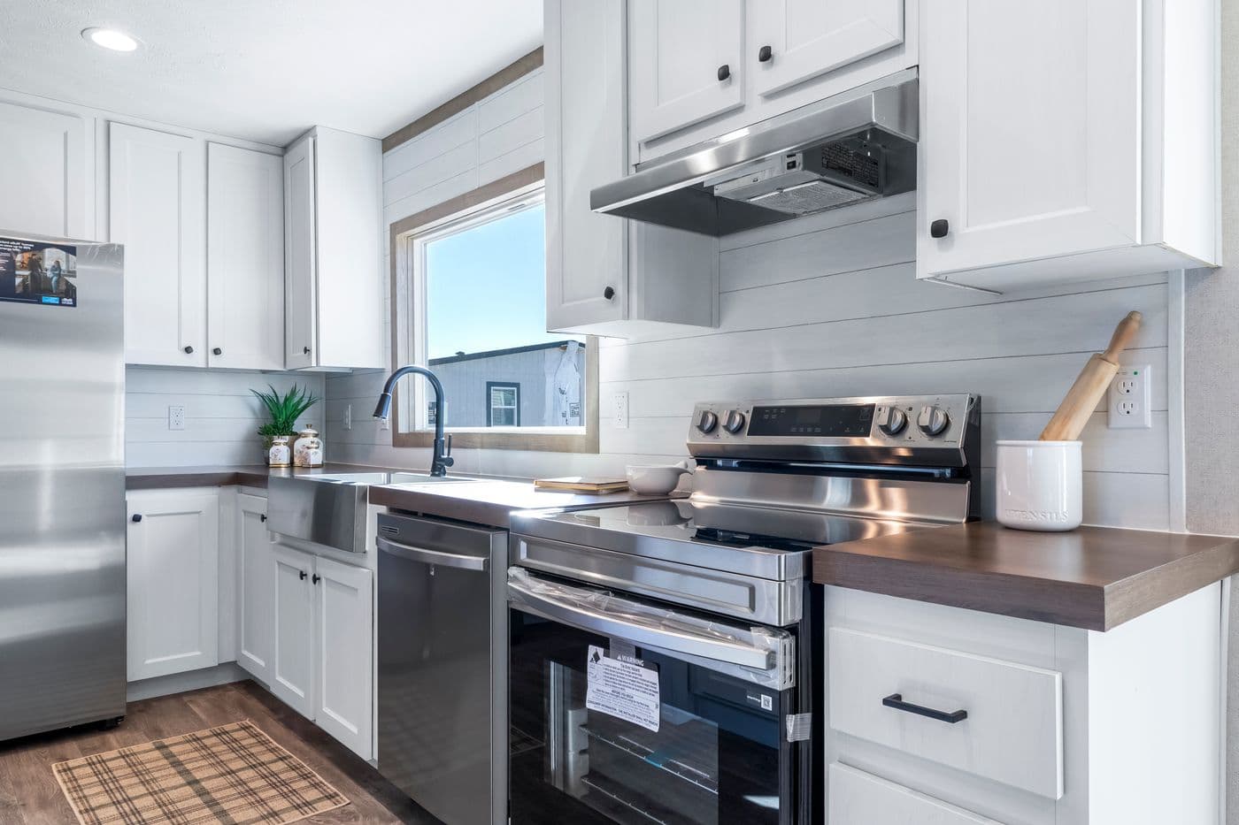 The THE BIG DEAL 52 Kitchen. This Manufactured Mobile Home features 3 bedrooms and 2 baths.